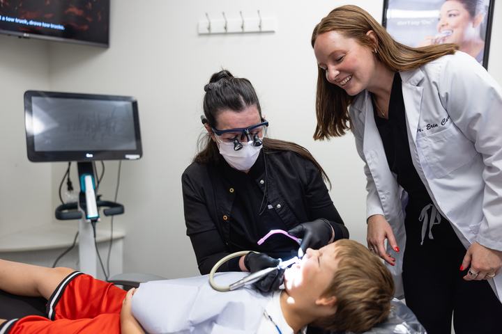 Doctor and assistant caring for a young patient