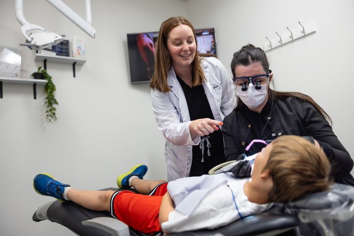 Doctor and assistant caring for a young patient