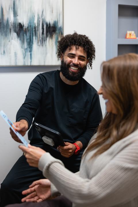 Treatment coordinator reviewing options on a tablet