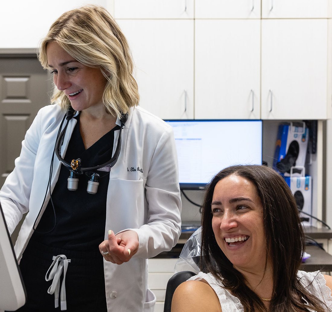 Dr. Elizabeth Rosenthal reviewing a digital scan with a smiling patient at daily DENTAL & bracesbar